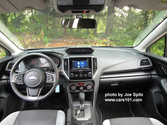 2018 Subaru Crosstrek 2.0i CVT, light and dark gray cloth with black stitching, vinyl covered steering wheel, silver shift plate, vinyl shift knob, 6.5" audio screen
