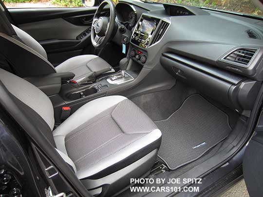 2018 Subaru Crosstrek 2.0i CVT, base model,  light and dark gray cloth with black stitching, silver shift plate, Crosstrek logo carpeted floor mat