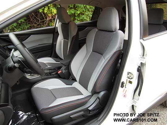 2018 Subaru Crosstrek Premium light and dark gray cloth interior with orange stitching, leather wrapped steering wheel. Note- in some photos the light gray may appear almost white, its really a light pewter gray