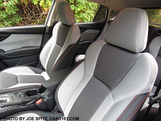 closeup of the 2019 Subaru Crosstrek Premium light and dark gray cloth with orange stitching. Upper seat back and headrest shown.  Note- in some photos the light gray may appear almost white, its really a pewter gray