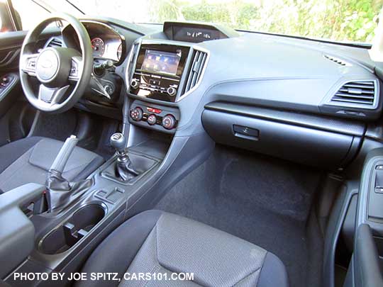 2018 Subaru Crosstrek 2.0i (base model) interior with manual 6speed transmission, gray cloth, black stitching, no heated seat buttons