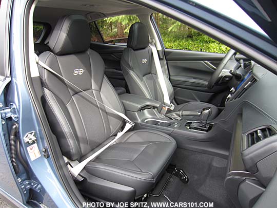 closeup of the 2018 Subaru Crosstrek Limited 50th Anniversary Edition black leather front seats, with silver seatbelts, silver stitching, embroidered seatback logos and floor mats... Only 1,050 50 Anniversary Crosstreks made, all heritage blue