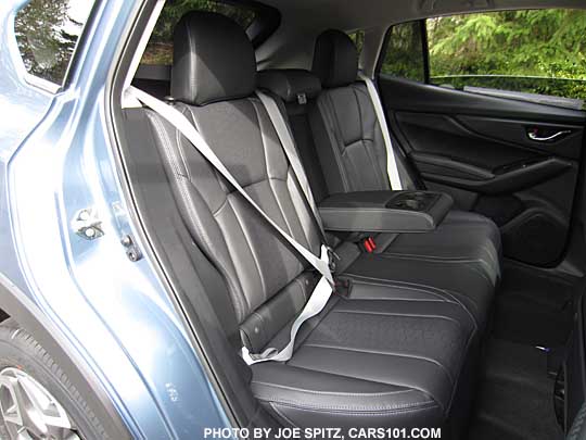 closeup of the 2018 Subaru Crosstrek Limited 50th Anniversary Edition rear seats- black leather with silver seatbelts, silver stitching, embroidered seatback logos and floor mats... Only 1,050 50 Anniversary Crosstreks made, all heritage blue