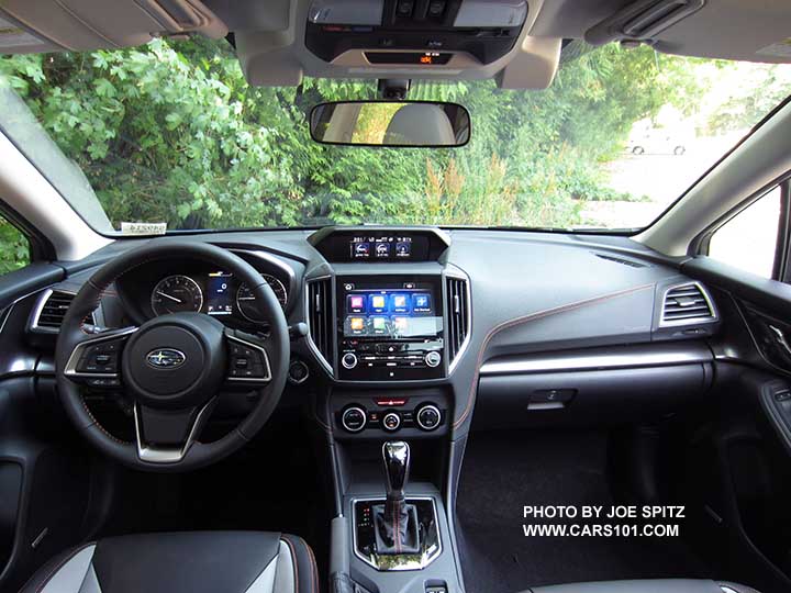 2018 Subaru Crosstrek Limited interior and dash with optional eyesight cameras, and gloss black shift plate, silver dash trim, climate control,  8" audio, dark and light gray leather interior with orange stitching