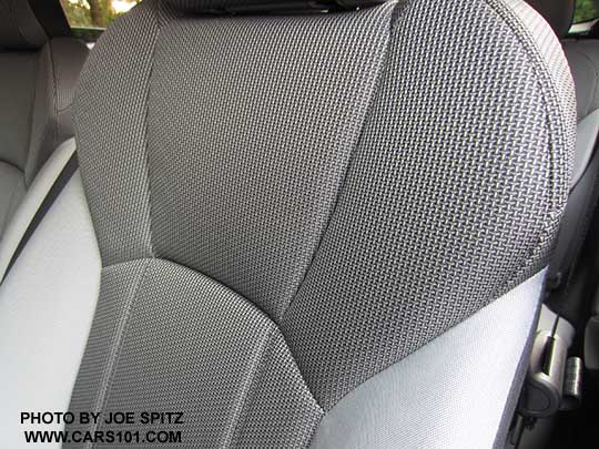 closeup of the 2018 Subaru Crosstrek 2.0i (base model) black cloth seat material, with black stitching.  Upper drivers seatback and headrest shown