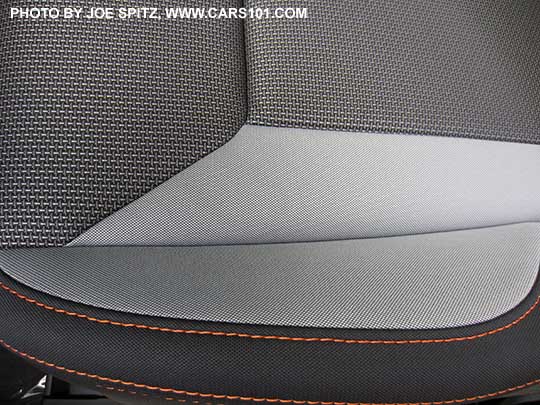 closeup of the 2019 Subaru Crosstrek Premium light and dark gray cloth with orange stitching.  Driver's seat cushion shown. Note- in some photos the light gray may appear almost white, its really a pewter gray