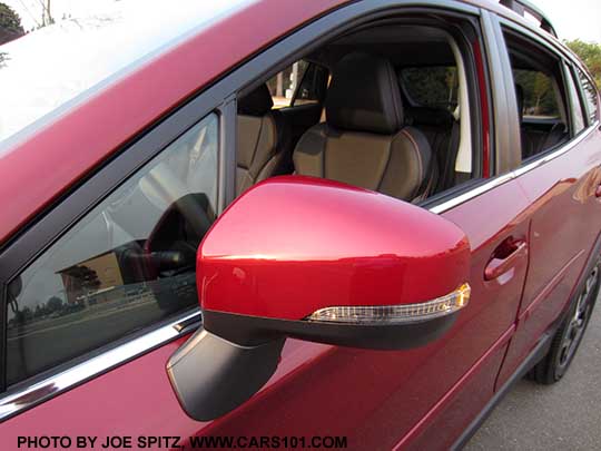 2018 Subaru Crosstrek Limited outside mirrors, body colored, with integrated new for 2018 LED turn signals. Bright window trim. Venetian red car with black leather interior shown