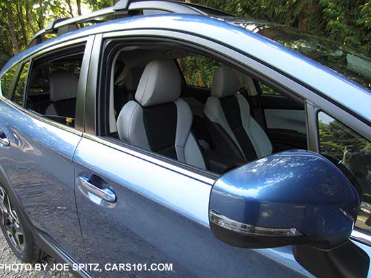 2018 Subaru Crosstrek Limited body colored outside mirror with integrated LED turn signals. On a quartz blue car with gray leather interior