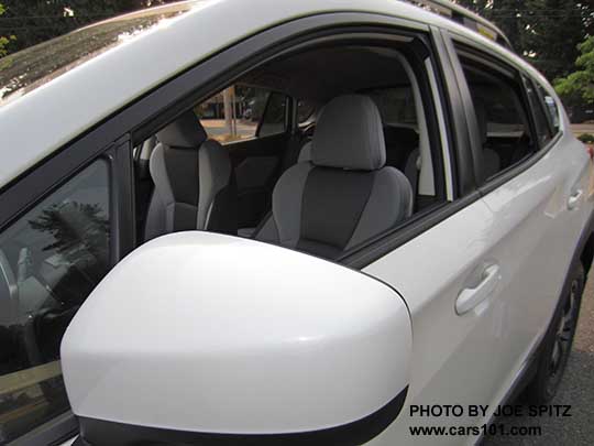 2018 Subaru Crosstrek Premium outside mirror, body colored. White car with gray cloth interior shown.