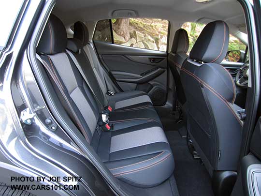 2018 Subaru Crosstrek Limited rear seat. Black cloth interior shown with orange thread stitching