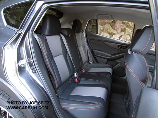 2018 Subaru Crosstrek Limited rear seat. Black cloth interior shown with orange thread stitching