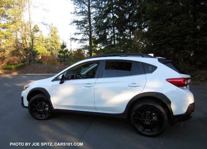 2018 white Subaru Crosstrek Limited with optional Sport Package with 18" black STI alloys, STI rear spoiler, and STI shift knob