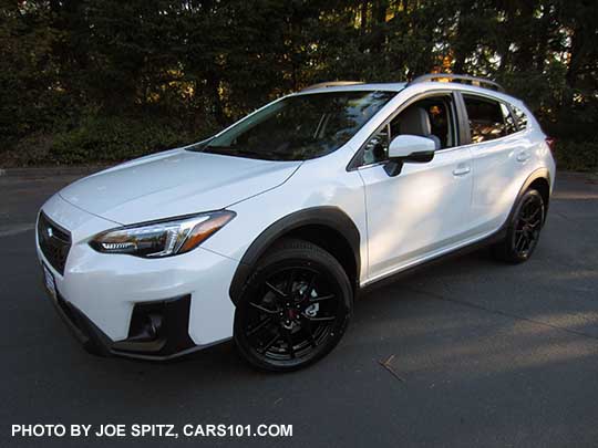 2018 white Subaru Crosstrek Limited with optional Sport Package with 18" black STI alloys, STI rear spoiler, and STI shift knob