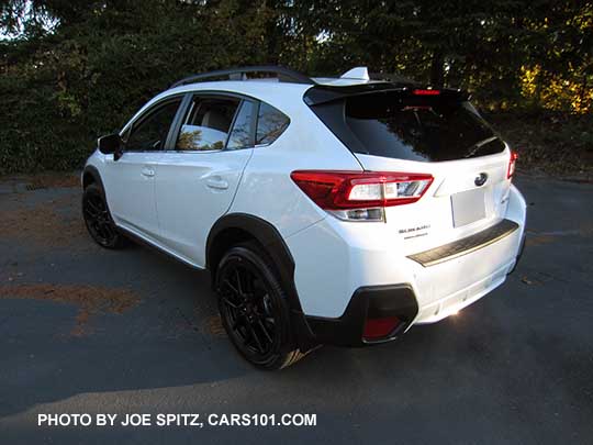 2018 white Subaru Crosstrek Limited with optional Sport Package with 18" black STI alloys, STI rear spoiler, and STI shift knob