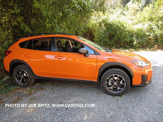 2018 Subaru Crosstrek 2.0i base model with unpainted black outside mirrors. Sunshine orange shown.