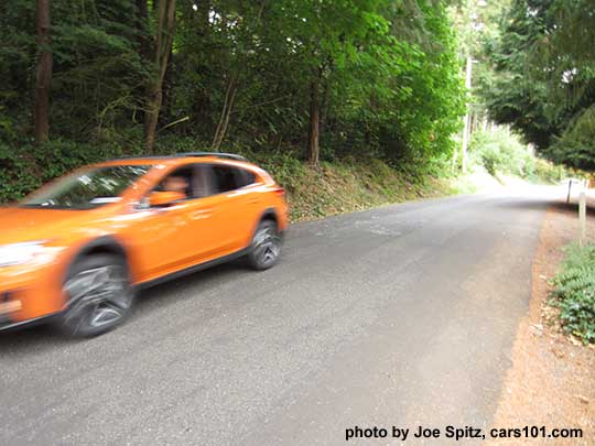 2018 Subaru Sunshine Orange Crosstrek on the road