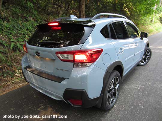 2018 Subaru Crosstrek Limited, cool gray khaki color. This color changes depending on sunlight vs shade. This car is in the shade. Optional gloss black STI rear spoiler and body side moldings shown.