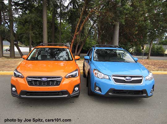 front view side by side  2018 redesigned Subaru Crosstrek Limited, sunshine orange color next to a 2016 HyperBlue Crosstrek