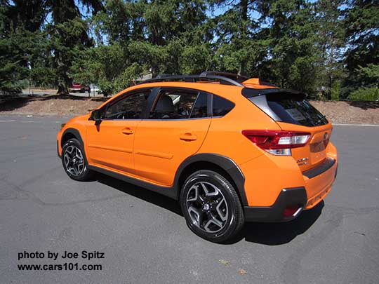 2018 Subaru Crosstrek Limited has 18" alloy wheels. Sunshine orange shown with optional body colored bodyside moldings