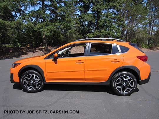 side view 2018 Subaru Crosstrek Limited has 18" alloy wheels. Sunshine orange shown with optional body colored side moldings