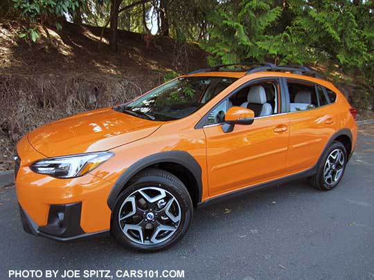 2018 Subaru Crosstrek Limited sunshine orange, has 18" alloy wheels. Shown with optional body side moldings