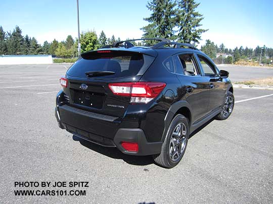 rear view crystal black 2018 Subaru Crosstrek Limited with optional aero crossbars and rear bumper cover