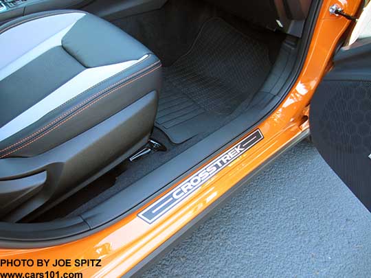 2018 Subaru Crosstrek optional door sill plates, front passenger door shown. sunshine orange car.