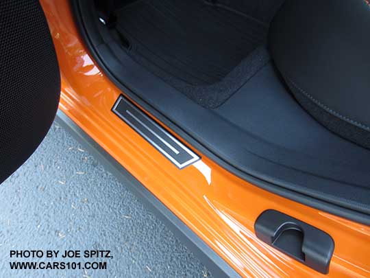 2018 Subaru Crosstrek optional door sill plates, rear door shown. sunshine orange car.
