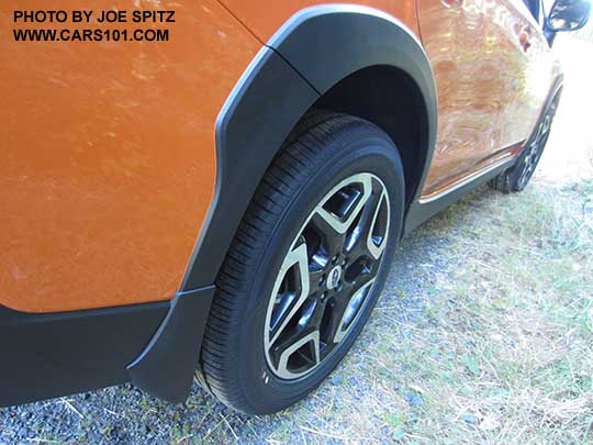 2018 Subaru Crosstrek optional splash guard. Set of 4, right rear shown on a sunshine orange Limited model (note the Limited wheel) .