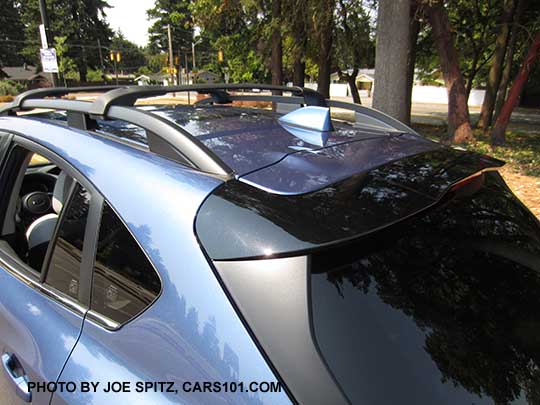 2018 Subaru Crosstrek gloss crystal black rear spoiler with LED upper brake light, standard on all models. quartz blue car shown.