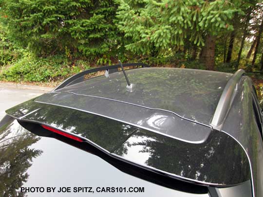 2018 Subaru Crosstrek gloss crystal black rear spoiler with LED upper brake light, standard on all models. Shown on a gray 2.0i base model - notice the mast antenna.
