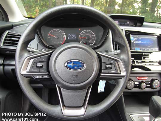 2018 Subaru Crosstrek 2.0i vinyl covered steering wheel, tilt, telescoping, with audio, blue tooth, cell phone, and cruise control buttons.