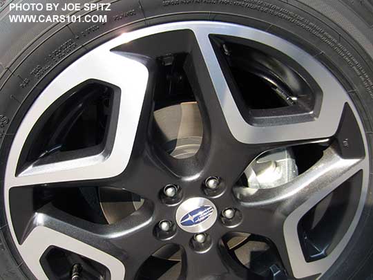 closeup of the 2018 Subaru Crosstrek Limited 18" machined black and silver alloy wheel.