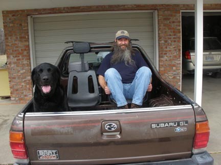 Jimi the dog in the back of a 1985 Subaru Brat