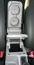 center console sildes for armrest, also opens with storage, rear cupholders