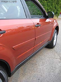 body side moldings, shown on 2010 Paprika Red Pearl Forester
