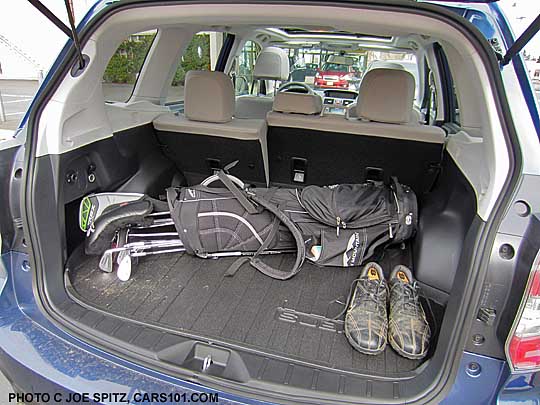 golf clubs in the
                    back cargo narea of a 2014 subaru forester