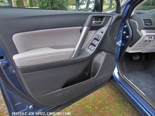 front door panel on 2014 subaru forester with gray interior,  leather shown