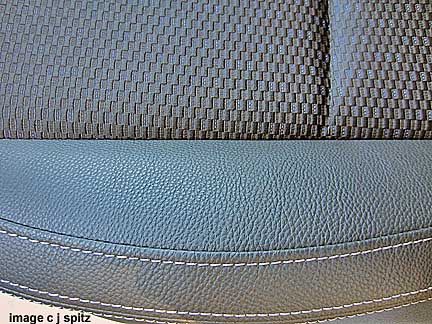 closeup of 2014 forester xt premium black cloth with vinyl trim, silver stitching
