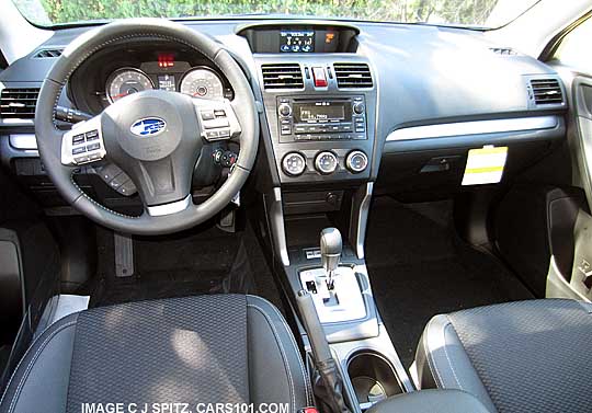 full interior of the 2014 forester xt premium with black cloth with vinyl trim, silver stitching