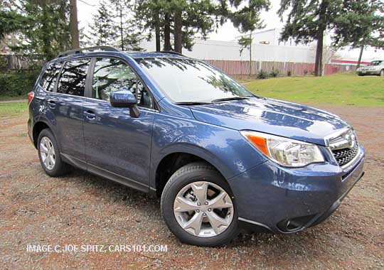 blue 2014 subaru x forester limited with rear spoiler