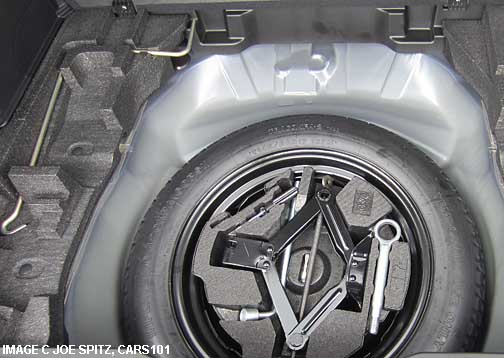 2014 forester temporary spare tire is under the cargo area subfloor storage