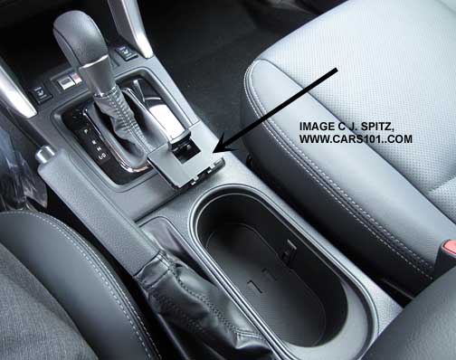 Forester Touring console with cupholder divider removed, see arrow
