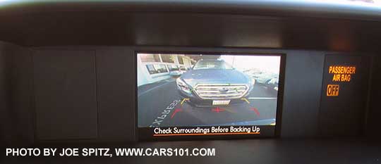 close up of the 2015, 2014 Subaru Forester rear view camera displays in this small, low resolution screen on top of the dashboard