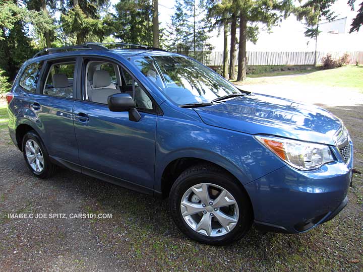 2016, 2015 Subaru Forester 2.5i base model with Option Package #02, alloy wheels, roof rails. Quartz blue color, unpainted black mirrors