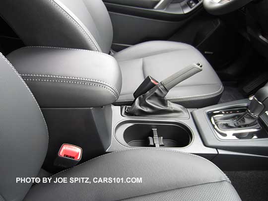 2016 Subaru Forester sliding center armrest is on all except base 2.5i model. touring model black shift surround, off black leather shown