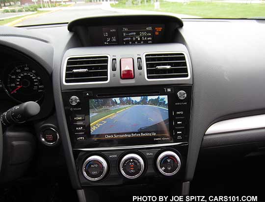 2016 Subaru Forester 7" audio system showing the rear view backup camera. Touring model shown with dual front zone automatic climate control