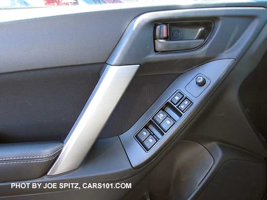 closeup of the 2016 Forester 2.5i inner door panel with black door handle