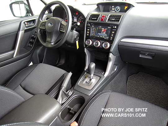 2016 Subaru Forester Premium CVT interior. Black cloth, silver shift surround, vinyl wrapped steering wheel, 7" audio screen