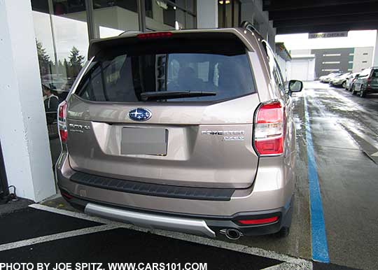 2016 Subaru Forester optional rear bumper underguard and rear bumper cover, shown on a burnished bronze Touring model